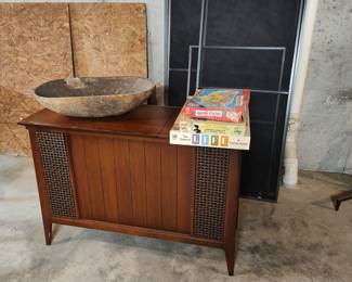 Vintage stereo, bread tray, and classic board games. Two other cabinet stereos not pictured.