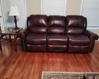 Dual reclining leather sofa