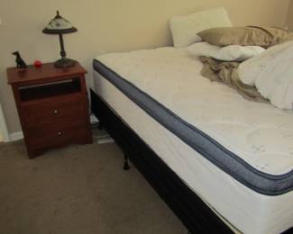 queen mattress, box spring and frame bed set in master bedroom