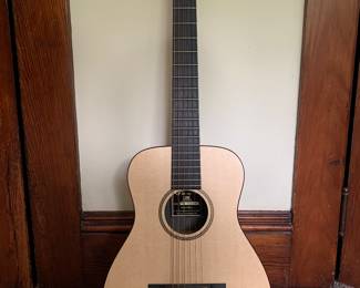C.F. Martin & Co. “Little Martin” LXM 3/4 sized guitar. Like new with original case and strap.