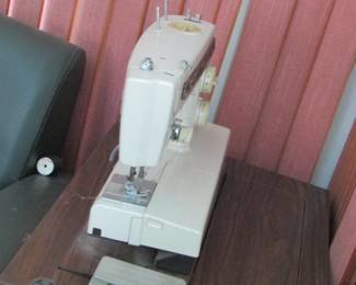 Kenmore sewing machine in cabinet