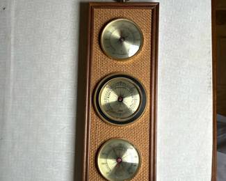 Jason Mounted Weather Station | Vintage (mid 20th c.) Jason (Japan) brand brass and grasscloth mounted weather station, including barometer (pressure), thermometer (temperature) and hygrometer (humidity). - h. 14 5/8 x w. 5 x d. 1 in