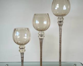 (3pc) Tall Stemmed Votive/Candleholders | Set of 3 tall stemmed votive/candleholders with blown glass bowls and painted metal base. Tallest: h. 20". Middle: h. 16". Shortest: h. 12"