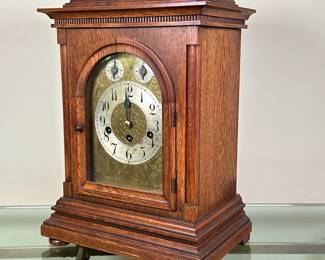 Junghans German Bracket Clock | Vintage (early 20th c.) Junghans (German) bracket clock with Westminster chimes, winding key and pendulum
Dimensions: h. 18 x w. 12 x d. 8 in
