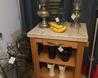 Kitchen rolling table, Oil Lamps, wrought iron birdcage & more (banana for scale)