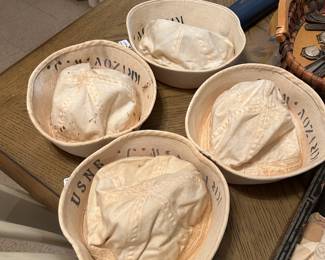 4 stenciled U.S.N.R. stenciled sailor caps, also more hats, uniforms and period clothing in the barn