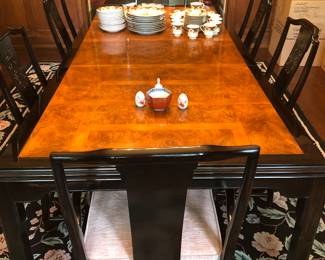 Burl wood top black lacquer dining table probably by Century (must be used with 1 leaf in place). Set of 6 Black lacquer, Chinese style dining chairs by probably by Century.