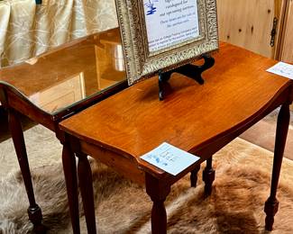 Their skin rug. Pair of side tables.