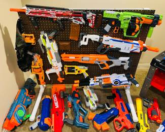 Large collection of Nerf guns and accessories
