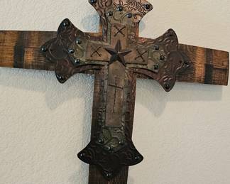 very large cross made out of a barrel 