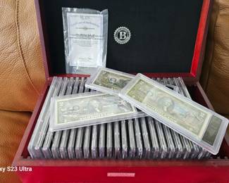 collection of $2 bills , sold as lot
