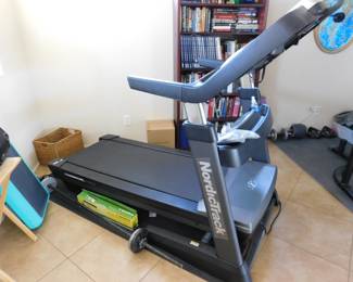 NoricTrack iFIT X16 Treadmill. This monster of a machine boasts around the world visual workouts, 16 in touchscreen, blutooth, wifi enabled streaming, 40% incline and up to 12mph motor. Full fan and music inputs.