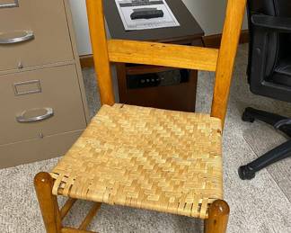 One of a MATCHED PAIR of Primitive Caned Chairs