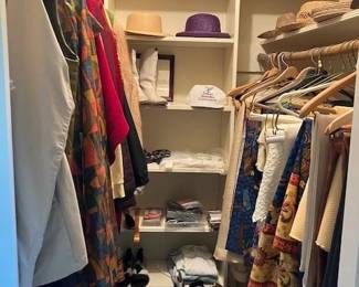 Closet full of vintage linens, clothing, boots, hats
