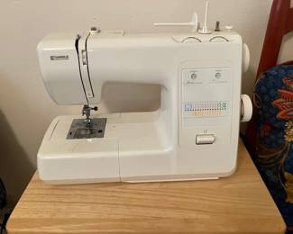 Kenmore electric portable sewing machine, attachments, paper work