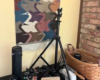 Hand woven wall art, vintage cameras, lens, accessories.