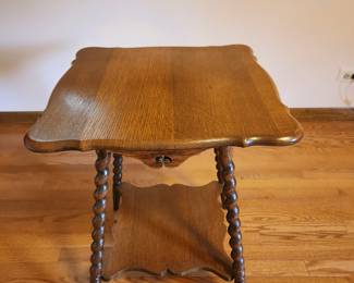 Antique parlor table or side table with scalloped edges and beautiful spindle legs