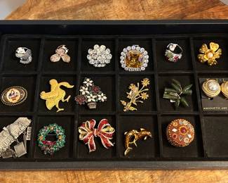 Costume jewelry brooches and rings