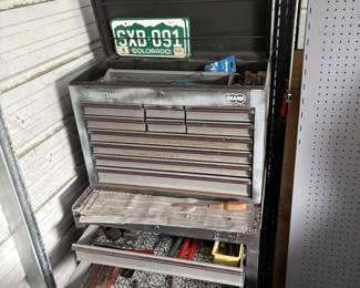 Tool box with large assortment of tools.