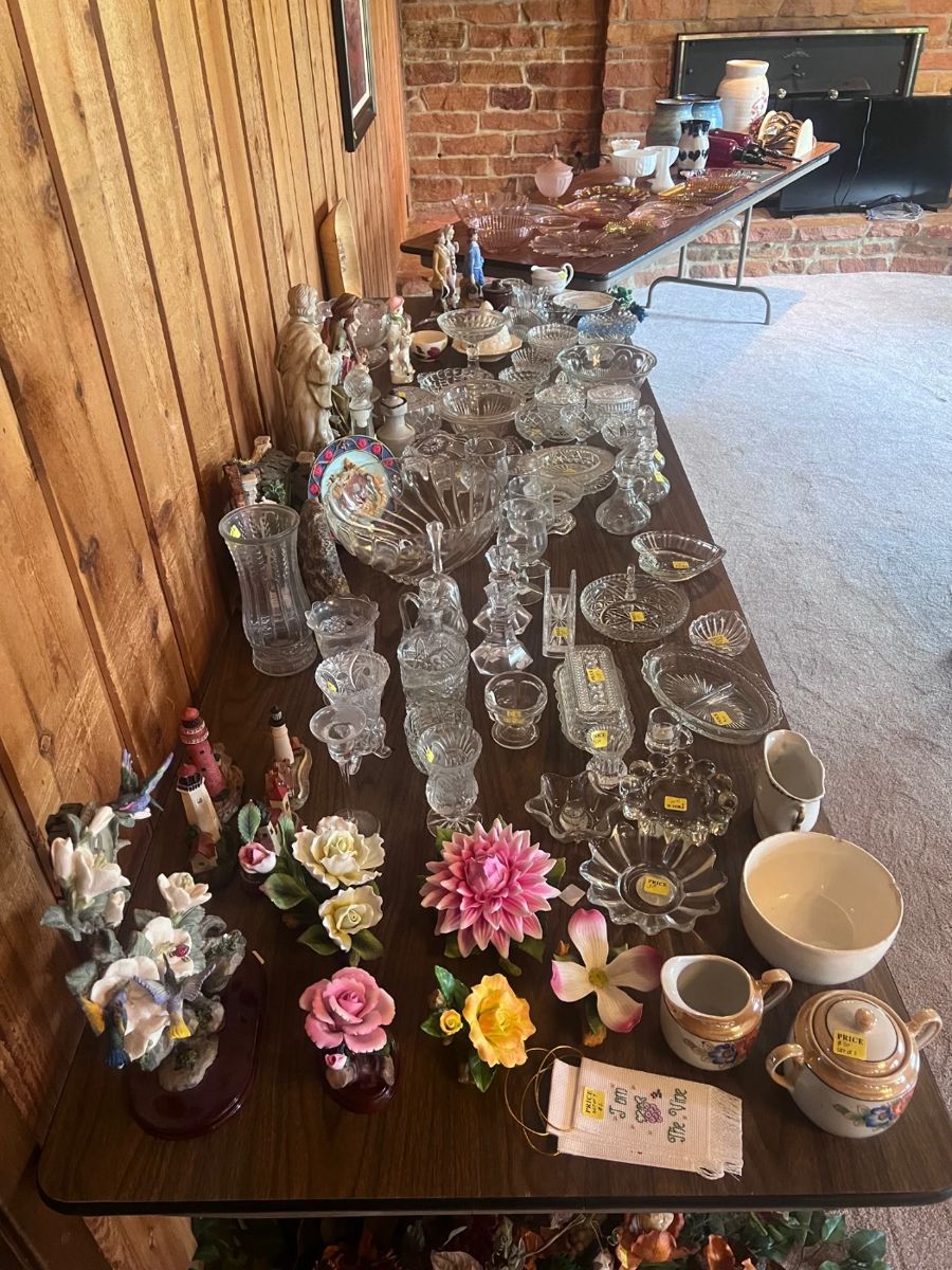 Porcelain flowers, lead crystal pieces, and vintage glassware.