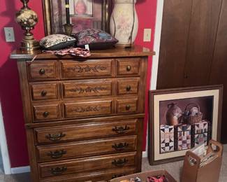 Chest of Drawers, lamps, and Amish fiction books.