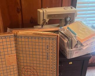 Older sowing machine, sowing machine cabinet, lots of cards for different occasions.