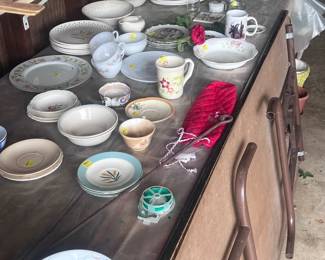Vintage plates, saucers, and cups.