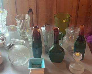 Glass tea pot, vintage glass pitchers, other vases.