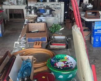 Cookware, knives, picture frames, vintage ironing board and cross stich rings.