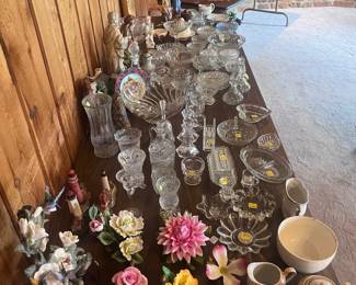 Porcelain flowers, lead crystal pieces, and vintage glassware.