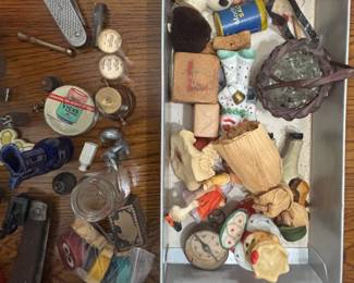 Some watches, knives, miniature figurines, odds & ends, etc. Lots of little treasures.
