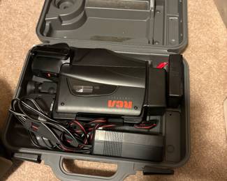 Vintage RCA camcorder with attachments in case