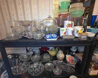 Dining room - pressed & cut glass clear collectible items including candy dishes, pitchers, bowls on stands, cake cover & stand, S/P shakers, divided platter, teapots, urns, and much more