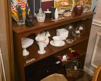Shelves in dining room, collectibles include milk glass in various sizes & shapes, tray, baskets, tray