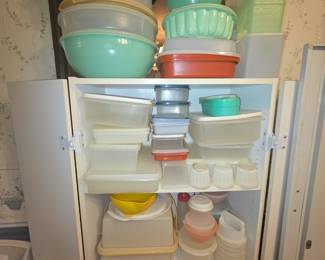 This cabinet is full of so many various vintage Tupperware pieces