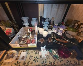 Home decor - set of bird plates, glass apple, pink glass candle holders, bowls, metal shoes, candle holders, purple & white tea set, pink & white creamer & sugar bowl, vases, pitcher & oriental man statue,mbox of bells, glassware, spoons, & other miscellaneous items