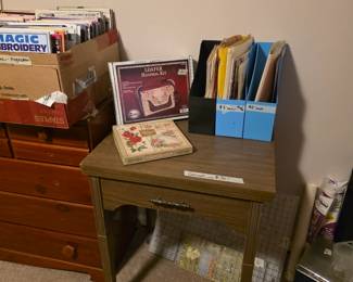 Vintage sewing machine cabinet - no machine, chest to left with books-phamphlets