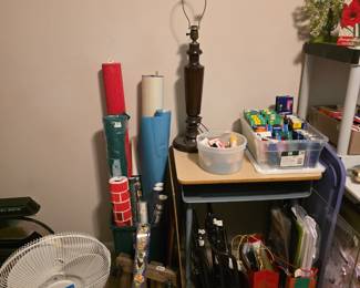 Rolls of paper, lamp w/o shade, miscellaneous wrapping paper & more