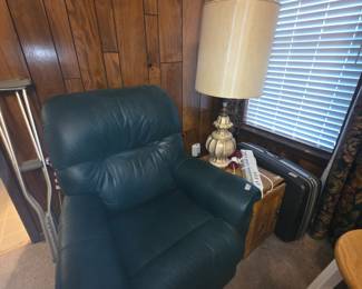 Green rocker recliner, lamp, side table & suitcase