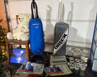 2 WORKING VERY NICE ORECK VACUUMS WITH LOTS OF BAGS.