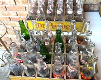WONDERFUL COLLECTION OF VINTAGE SODA BOTTLES AND CRATES.