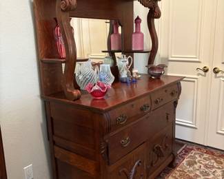 ABSOLUTELY STUNNING ANTIQUE SIDEBOARD BUFFET. WITH A SWEET COLLECTION OF VINTAGE FENTON ARTGLASS.