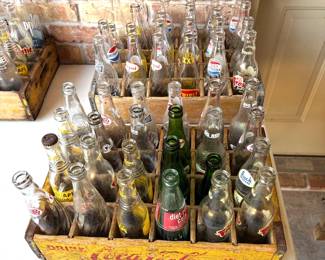 WONDERFUL COLLECTION OF VINTAGE SODA BOTTLES AND CRATES.
