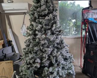 9 ft flocked Christmas tree pre lit