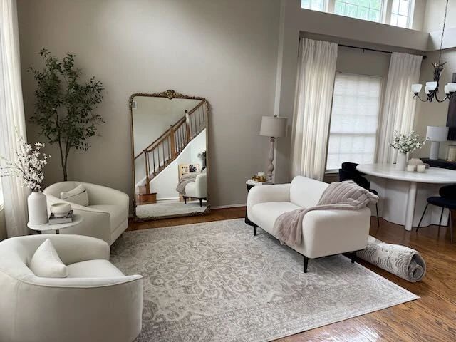 This tranquil sitting area is to the left as you walk in the front door. A large Anthropologie Mira Floor Mirror is serving the looks