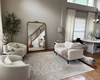This tranquil sitting area is to the left as you walk in the front door. A large Anthropologie Mira Floor Mirror is serving the looks
