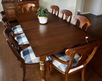 D70 - $950. Ethan Allen 8-Person Dining Table - Farmhouse Style. 2 arm chairs. 6 regular chairs. Measures 90.5 x 41 x 30 (no leaf). Table has some scratches and cosmetic damage, please see photos. Solid & Sturdy!
