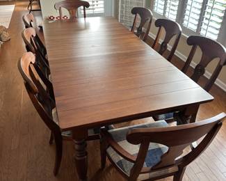 D70 - $950. Ethan Allen 8-Person Dining Table - Farmhouse Style. 2 arm chairs. 6 regular chairs. Measures 90.5 x 41 x 30 (no leaf). Table has some scratches and cosmetic damage, please see photos. Solid & Sturdy!