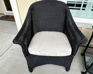 D28 - $100 Set - As is. SEE PHOTOS. Black Wicker Outdoor Set. Two Cushioned Chairs and Rolling Cart Style Table. Wicker is strong and tight. **Under the cushions are torn and need repair! The black paint does have some signs of wear around the arms. Please see photos.