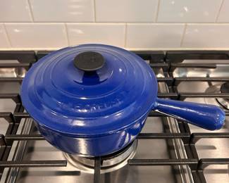 D43 - $50. Le Creuset Sauce Pan #20. 2 qt. Hollow handle. Outside is in great condition. Inside has staining but enamel is intact.